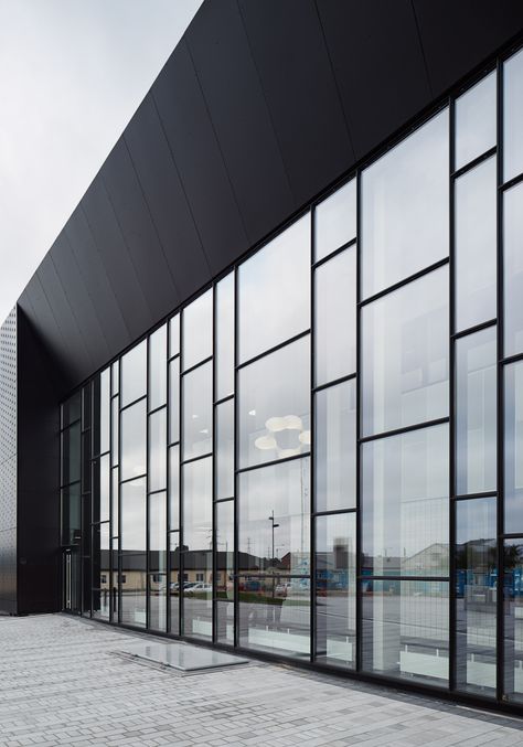 Ystad Arena Bad, Ystad | Brick And Glass Architecture, Glass Facade Architecture Design, Glass Wall Exterior, Glass Building Architecture, Asymmetrical Windows, Glass Building Facade, Factory Architecture Industrial Facade, Factory Facade Design, Factory Facade