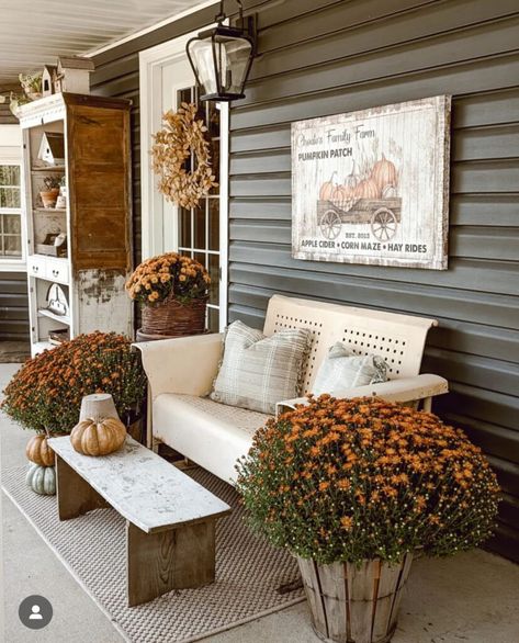 Front porch decorated for fall with rust colored mums, fall sign hung above a vintage metal settee and wood bench. Cozy pillows styled on the settee. Cozy Fall Porch, Kitchen Sink Remodel, Porch Inspiration, Fall Front Porch Ideas, Porch Bench, Fall Front Porch Decor, Floor Remodel, Small Front Porches, Fall Front Porch