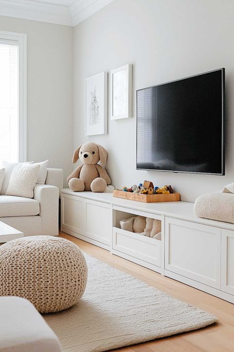 50+ Living Room Toy Storage Ideas That Keep Everyone Happy Tv Wall Playroom, Toy Storage Bench Living Room, Tv Unit Toy Storage, Ikea Toy Storage Under Tv, Playroom Built Ins With Tv, Diy Kids Storage Ideas, Tv Playroom Ideas, Kids Playroom Storage Ideas, Playroom With Tv