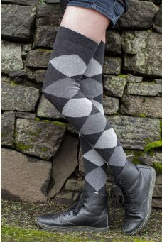 Model wears dark charcoal cotton blend over the knee socks, patterned with medium charcoal and light grey diamonds.