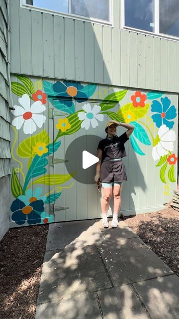 Jillian Goeler on Instagram: "Paint a mural with me!  I had the pleasure of painting some sweet florals on a residential shed this week 🥰 It was SWEATY but we persisted and the result is so cute!   This one’s a little different than my usual…no lettering and no stars!? ✨ who am I??" Wall Mural Design Ideas, Outdoor Floral Mural, Garden Murals Outdoor, Painted Shed Mural, Mural On Shed, Simple Flower Mural, Shed Murals Outdoor, Door Paint Design, Floral Mural Painting