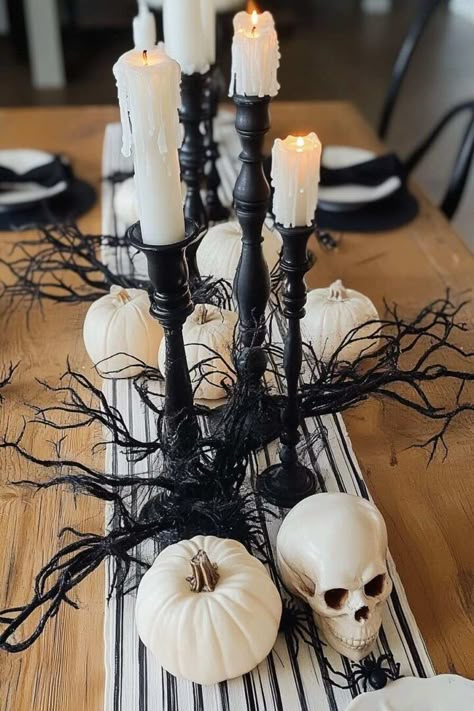 20 Boo-tiful Halloween Table Centerpiece Ideas to Haunt Your Guests - H.M.G Simple Halloween Table Centerpieces, Skeleton Dining Table Decor, Halloween Banquet Decorations, Halloween Decor For Kitchen Table, Small Halloween Centerpieces, Table Centerpiece Halloween, Dollar Tree Halloween Table Decor, Halloween Candle Centerpieces, Halloween Food Table Decor