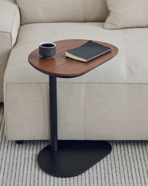 While its design may be understated, this #AlmondSideTable proves to be the ultimate practical companion in your home. Its petite frame boasts remarkable stability, providing a secure platform for your daily essentials. Whether nestled beside the sofa, the chair, or even the bed, it effortlessly blends into any space, always at hand when needed most. 💫🏡 Find it more on the link in bio.🥳 #ourgrado #gradoliving #gradodesign #Sidetable #storage #VersatileDesigns Narrow Staircase, Metal Cylinder, Walnut Side Tables, C Table, Chair And A Half, Side Table Design, Table Throw, Table Cafe, Ottoman Stool