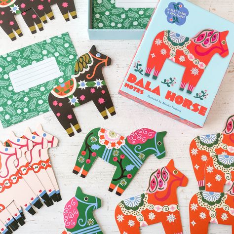 Add a dash of Scandinavian charm to your correspondence with beautiful Dala horse-shaped notecards! These whimsical illustrated notecards celebrate the charm and beauty of Scandinavian folk art, honoring the beloved tradition of the painted Dalecarlian horses that have galloped into hearts and homes all over the world. Perfect for holiday greetings, these shaped notecards also make lovely thank-you, birthday, or just-because greeting cards. Send or display the colourful Dala horses year-round! 1 Horse Box, Dala Horse, Scandinavian Folk Art, Notecard Set, Packaging Ideas, Holiday Greetings, Christmas Presents, Dahlia, Note Cards