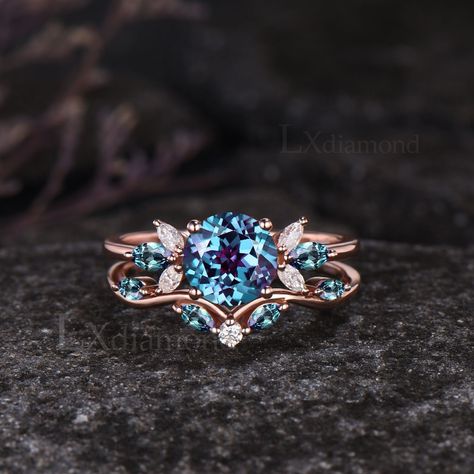 Item description ✦ Handmade, high-quality item! ✦ Material: 925 sterling silver, Solid 10k/14K/18K GOLD (can be made in white/rose/yellow gold) Engagement ring ✦ Center stone: Lab Alexandrite. ✦ Size/Weight: 7mm Round Cut ✦ Side stones: Marquise Cut Lab Alexandrites and Moissanites. Wedding bands ✦ Gemstones: Marquise Cut Lab Alexandrites and Round Cut Moissanites. Any ring size can be made,if the ring size is not in the option list ,contact me. As it is handmade,it needs 3-4 weeks to finish and then be shipped by usps or DHL. Return policy: We offer 30 days return policy. For any reason, if you are not completely satisfied with your order, you may return it for a refund.  Buyer is responsible for the handcraft fee (15%-30% of the total price) and the return shipping cost. Alexandrite And Moonstone Ring, Ring Shapes Engagement, Engagement Rings Alexandrite, Blue Stone Engagement Ring, Engagement Rings Women, Alexandrite Wedding Ring, Marquise Engagement Ring, Pretty Engagement Rings, Future Engagement Rings