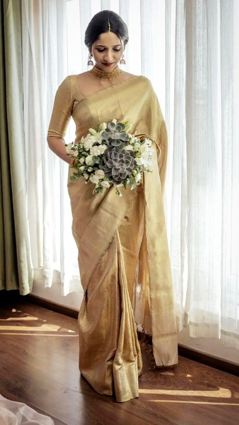 Christian Engagement Saree Looks, Golden Wedding Saree Kerala, White Bridal Saree Christian, Golden Saree For Wedding, Christian Bridal Blouse Designs, Golden Saree Bride, Bridal Saree With Veil, Golden Bridal Saree, Kerala Christian Wedding Saree