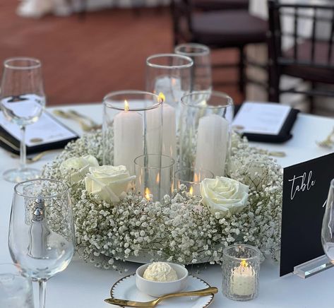 White Roses Baby’s Breath Centerpiece, White Rose Reception Decor, White Roses And Baby Breath Centerpieces, Candles And Baby’s Breath Centerpieces, Baby Breathe Center Piece Ideas, Nikkah Centerpieces, Baby’s Breath And Greenery Wedding Centerpieces, Rose And Baby Breath Centerpiece, White Roses And Babysbreath Centerpieces