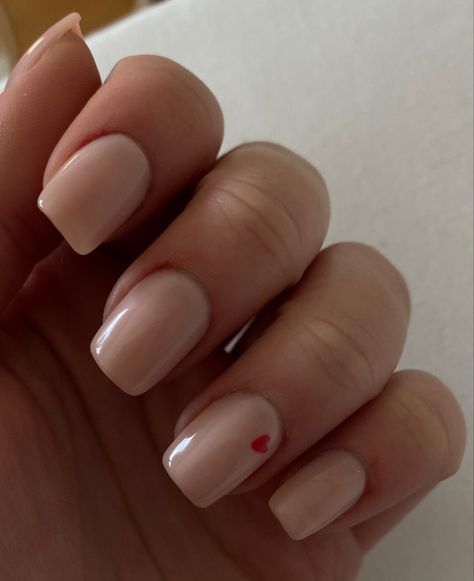 Nude nails, red heart, valentine’s day , nails , acrylic nails Beige Valentines Nails, Nude Nails Red Heart, Simple Valentines Day Nails Medium Length, Red Small Nails, Nude Nails With Red Heart, Short Nail Designs Nude, Nude Nails With Heart Design, Nude Valentines Day Nails, Nude Nails With Heart