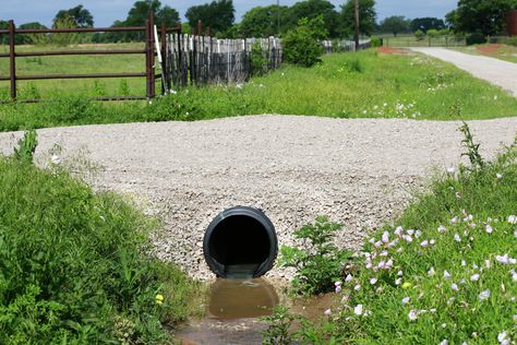 5 Ways to Stop Erosion Around Culverts | Hunker Sloped Driveway Drainage Solutions, Driveway Culvert Ideas, Diy Culvert Ideas, Culvert Landscaping Ideas Drainage Ditch, Culvert Landscaping Ideas, Culverts Ideas, Driveway Culvert, Water Erosion, Backyard Landscapes