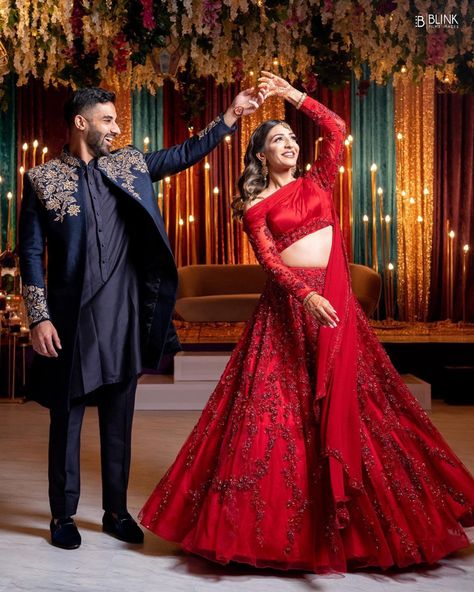 We can’t take our eyes of this gorgeous couple #TabsAllin on their Sangeet night ⁣ For Panache bride Allina we created a dazzling monotone lehenga and a one-shoulder crop top with an attached cape that she danced the night away in ❤️💃🏻 Sangeet Poses For Bride And Groom, Sangeet Couple Outfits, Monotone Lehenga, Sangeet Night Outfit, Sangeet Poses, Lehenga Shoot, Sangeet Night, Ladies Sangeet, Indian Bride Poses