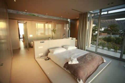 Half height wall behind the bed.  - behind the wall are the sinks and bathroom  - toilet is further behind, with it's own door. Half Wall Behind Bed, Bathroom Behind Bed, Wall Behind Bed, Bedroom With Bathroom, Villa Luxury, Bedroom With Ensuite, Bed Wall, Master Bedrooms Decor, Main Bedroom