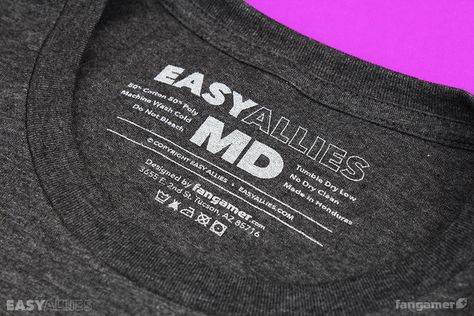 This official Easy Allies shirt was designed by Paul Robertson and printed on soft, 50/50 t-shirts from Canvas and District. (Unisex 3X-6X are 100% cotton shirts from Port & Company.) Each one comes with a very special bonus sticker drawn by Nina Matsumoto. Paul Robertson, Shirt Tags, T Shirt Label, Shirt Label, Printing Design, Cotton Shirts, Care Label, 50 50, Fashion Clothes