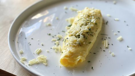 The Bear-Inspired Boursin Omelette Recipe - Tasting Table Boursin Omelette, French Omelette, Ruffles Potato Chips, Cooking Eggs, Spreadable Cheese, Boursin Cheese, Omelette Recipe, Clean Plates, Chef Hat