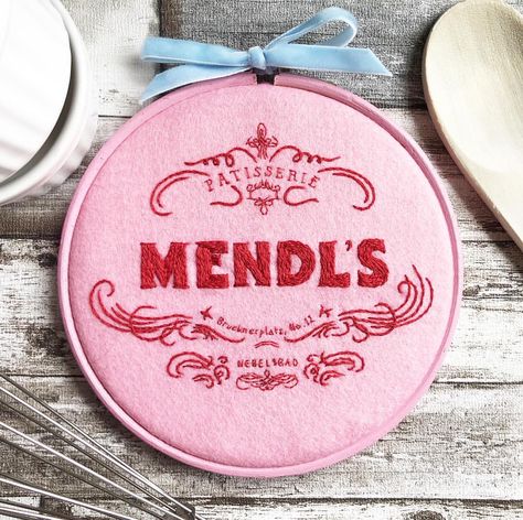 Mendl’s Patisserie piece, zoom in for teeeeny writing! 💖🎀🍥 Portrait Embroidery, Grand Budapest, Grand Budapest Hotel, Budapest Hotel, Textile Crafts, Pastry Shop, Wes Anderson, Hand Embroidery Art, Velvet Bow