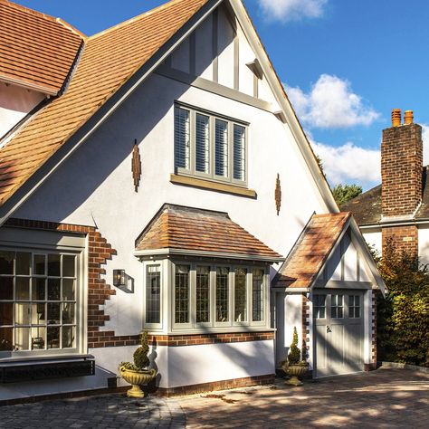 Flush casement #Painswick windows featured in this Cheshire renovation. These traditional yet modern frames have authentic  design details like mortise and tenon looks, a deep bottom rail, and The Radlington cill. . . . #timberalternative #timberlook #traditionalwindows #timberwindows #houserenovation #heritagewindows #flushwindows #agategrey #newwindows #flushsash #renovationproject #periodwindows #woodenwindows #houseproject #flushcasement #1930shome #periodliving #newwindowsanddoors #timberal Painswick Windows And Doors, Country House Exterior, Modern Bungalow Exterior, Grey Windows, Timber Frame House, Sash Window, Window Designs, Build Projects, Casement Window