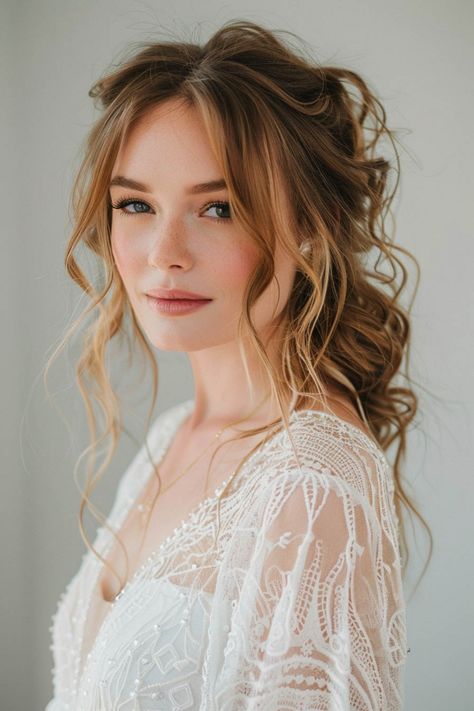 Elegant woman with soft smile wearing a lacy wedding dress and hairstyle with loose curls. Boho Style Wedding Hairstyles, Wedding Fairytale Hairstyles, Best Bridal Updos, 70s Bridesmaid Hair, Wedding Hair Inspiration Down, Down Hairdos For Wedding, Wispy Wedding Hair, Boho Bridal Hair With Flower Crown, Boho Hair For Wedding