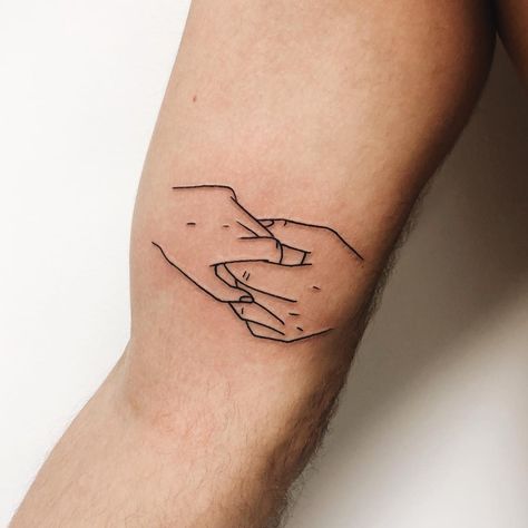 Outline two holding hands tattoo on the right bicep Two Hands Tattoo, Hand Holding Tattoo, Hand Tattoos Pictures, Hand Tattoo Images, Hand Outline, Small Wave Tattoo, Hands Tattoo, Unalome Tattoo, Finger Tattoo Designs