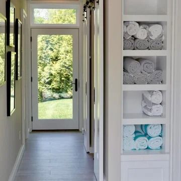 Pool House Storage - Photos & Ideas | Houzz Pool House Bathroom Changing Room, Pool Bath Storage, Pool Cabinet Storage, Pool House Laundry Room, Basement Pool House, French Doors To Pool, Pool House Mudroom, Pool House Changing Room Ideas, Pool House Cabinets