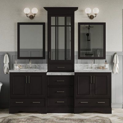 Make bathroom storage look glamorous with the Peighten vanity set series from ARIEL. The Peighten series includes white quartz countertops mounted above solid wood cabinets finished with satin nickel finish hardware. The matching framed mirrors accompanying this series round out the contemporary design for a complete look. Base Finish: Espresso Brown | Winston Porter Peighten 85" Double Bathroom Vanity Set w / Mirror Wood / Marble in Brown | 89 H x 85 W x 22 D in | Wayfair White Quartz Counter, Framed Mirrors, Solid Wood Cabinets, Vanity Set With Mirror, White Quartz Countertop, Double Sink Bathroom, White Marble Countertops, Double Sink Vanity, Double Bathroom