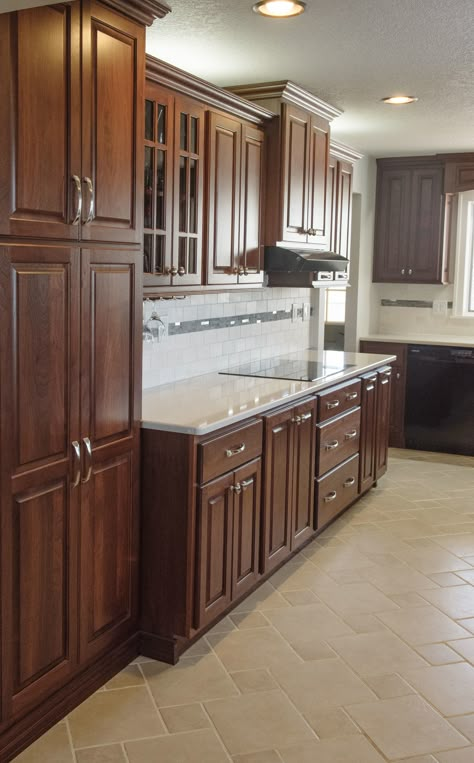 This kitchen is full of walnut cabinets with a deep mahogany finish. Mahogany Kitchen Cabinets, Mahogany Kitchen, Walnut Kitchen Cabinets, Hacienda Homes, Green Tea Recipes, Walnut Kitchen, Crocs Fashion, Walnut Cabinets, White Appliances