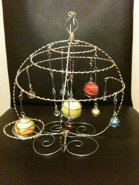 This is a (fairly) accurate wire model of our solar system from Twisted Wires. I made this a long time ago for a geeky boys birthday. It's made using different sized coloured marbles for each of the planets. Geeky Boy, Wire Mobile, Marble Ornaments, Wire Model, Planet Crafts, Space Stuff, Ascii Art, The Planets, Wrap Jewelry