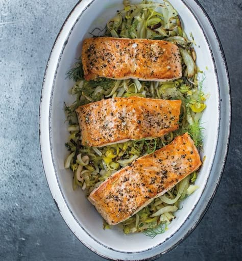 Salmon with Leeks, Fennel and Lemon | Baking salmon on top of leeks and fennel is an easy method for preparing the flavorful fish, and it takes less time than cooking all the components separately. Leek And Salmon Recipe, Salmon With Leeks, Fennel Salmon Recipes, Fish And Leeks Recipe, Salmon And Leeks, Leek And Fennel Recipe, Salmon And Leek Recipes, Salmon And Leeks Recipe, Salmon Fennel Recipe