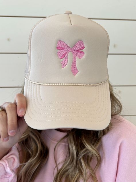 Rock the trends in style with our Coquette Trending Bow Embroidery White Trucker Hat Cap. This adjustable hat is perfect for any fun-loving individual looking to add a touch of quirk to their outfit. Get ready to make a statement with this playful and trendy accessory. adjustable Statement Hats, Costal Cowgirl, White Trucker Hat, Sunset Waves, Bow Embroidery, Statement Hat, Bow Birthday, Baby Birthday Decorations, Hat Aesthetic