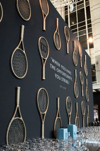 Tennis rackets adorn this custom bar | Luxury wedding, luxury event planner, event planner, event design, wedding inspo, wedding inspiration, event inspiration, chicago wedding, wedding details, wedding tablescape, modern wedding, wedding reception decor, floral design, wedding decor, chicago wedding venue, outdoor wedding reception, suprise birthday party ideas, birthday party decor, event decor, outdoor event reception, classic wedding decor, 2022 wedding trends, wedding tablescapes Event Decor Outdoor, Tennis Court Design, 2022 Wedding Trends, Classic Wedding Decor, Bar Luxury, Photowall Ideas, Party Ideas Birthday, Suprise Birthday, Floral Design Wedding