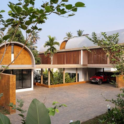 Barrel-vaulted concrete roofs are supported by thick laterite walls at The Stoic Wall Residence in Kerala, India, completed by local studio Lijo Reny Architects. Wooden Shutters, Concrete Roof, Health Ideas, Tropical House, Ground Floor Plan, Hot And Humid, House Extensions, Residential Architecture, Architect Design