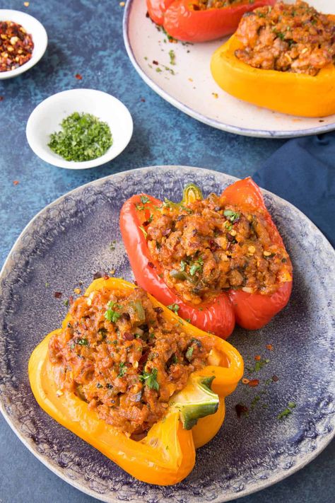 A recipe for flavorful bell peppers that are stuffed with a mixture of Italian sausage, tomato sauce, Parmesan cheese and plenty of seasoning, then baked to perfection. A family favorite. Stuffed peppers are so easy to make! Dinner Recipes With Peppers, Recipes With Peppers, Italian Sausage Stuffed Peppers, Stuffed Italian Sausage, Sausage Stuffed Peppers, Stuffed Recipes, Italian Sausage And Peppers, Stuffed Bell Peppers Recipe, Recipes Chili