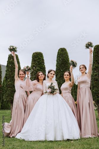 Stock Image: Group portrait of the bride and bridesmaids. Bride in a wedding dress and bridesmaids in pink or powder dresses and holding stylish bouquets on the wedding day. Bridesmaids In Pink, Before Wedding Pictures, Church Wedding Photos, Group Portrait, Bored Board, Wedding Picture Poses, Bridesmaids Photos, Bride And Bridesmaids, Catholic Wedding