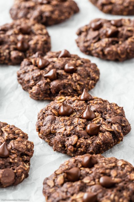 Double Chocolate Oatmeal Cookies! Heartwarming and freshly baked batch of oat infused cookies with dark chocolate chips and cocoa throughout. Crisp around the edges with a soft and slightly chewy middle. Infused Cookies, Cookies With Dark Chocolate, Simple Oatmeal, Chocolate Oat Cookies, Dark Chocolate Chip Cookies, Granola Cookies, Baked Sweets, Chocolate Oatmeal Cookies, Dark Chocolate Cookies