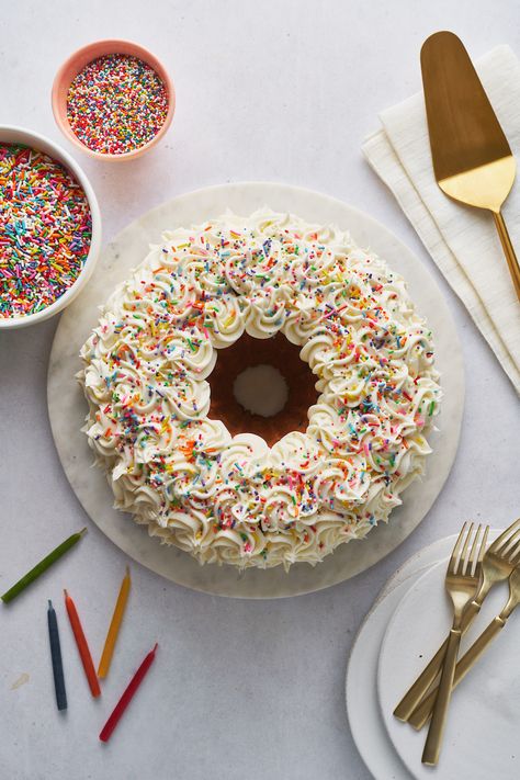 Funfetti Bundt Cake Birthday Cake - Baker by Nature Fun Bundt Cake Ideas, Cake Decorating Bundt Cake, Floral Decorated Bundt Cake, First Birthday Bundt Cake, Funfetti Bundt Cake Recipes, Bundt Cake Frosting Designs, Bundt Birthday Cake Decorating, Decorating A Bundt Cake Birthday, Mothers Day Bundt Cake