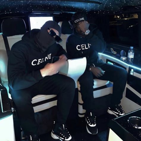 People in a car setting, wearing matching black Celine tracksuits Celine Tracksuit, Designer Tracksuits For Men, Hoodie Men Outfit, Uk Drip, Tracksuits For Men, Ayo And Teo, Hoodie Outfit Men, Designer Tracksuits, Black Men Fashion Urban