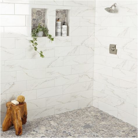 Create a spa experience in your own home. The Delfino stone collection by American Olean features a diverse selection of unique mosaic tile including this gorgeous gray pebble mosaic. Natural stone pebbles mounted onto a 12-in x 12-in sheet create an eye-catching finish to any space. American Olean Delfino Stone Bali Gray Blend 12-in x 12-in Unglazed Natural Stone Mixed Pebble Stone Look Floor and Wall Tile (1-sq. ft/ Piece) Stone Shower Floor, Master Shower Tile, Pebble Shower Floor, Marble Shower Tile, Subway Tile Showers, Pebble Floor, Interlocking Deck Tiles, Fireplace Facade, Stone Shower