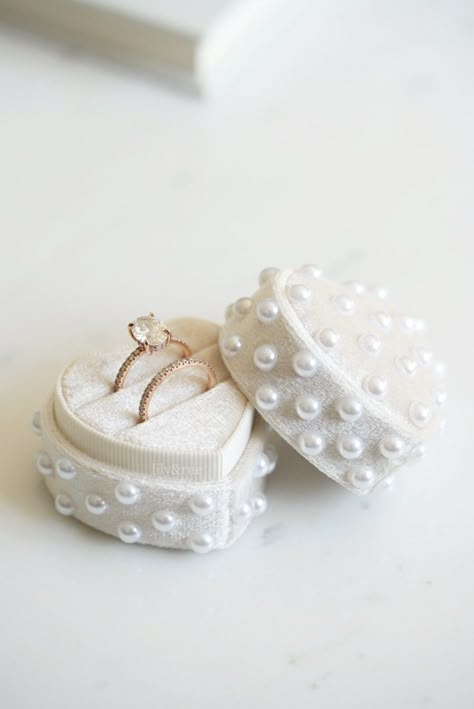 "This vintage-inspired velvet ring box will complement your wedding day theme and add a luxurious touch to your wedding day photos . An optional pearl accent offers a delicate finishing touch and you get the choice to add an extra slot for your wedding ring.  Every bride deserves to shine on their special day, why not add a special gift?  Ring Box Details: . Handmade assortment of 6mm faux pearls all over, adding an elegant touch . Made from high quality velvet  . Measures 2\" x 2\" . Please lea Green And Pearl Wedding, Engagement Ring Case, Wedding Rings Box, Wedding Ring Case, Pearl Wedding Reception, Wedding Ring Display, Pearl Wedding Inspiration, Pearls In Wedding Decor, Wedding Ring Box Ideas