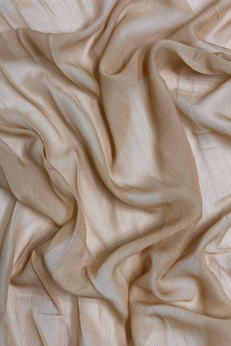 Sand Silk Heavy Crinkled Chiffon HCD-032 Fabric is 100% silk fabric with a pronounced crinkled texture. The word "chiffon" is French in origin and means "cloth". Our Silk Crinkled Chiffon comes in a wide range of colors, and it is utilized for bridal, eveningwear, overlays, lingerie, pants, blouses. Purchase Sand Silk Heavy Crinkled Chiffon HCD-032 Fabric by the Yard at NY Designer Fabrics. The fabric measures 54 inches in width. Tan Silk, Stacked Jewelry, White Texture, Fabric Texture, Drapery Fabric, Style Board, Fabric By The Yard, Silk Fabric, Fabric Care