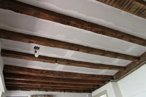 A DIY tutorial on how to expose wood beams in an antique post and beam farmhouse. See a complete ceiling makeover to reveal original wood beams. Post And Beam Farmhouse, Basement Diy, Ceiling Covering, Basement Lighting, Basement Furniture, Basement Inspiration, Diy Basement, Basement Ceiling, Basement Walls