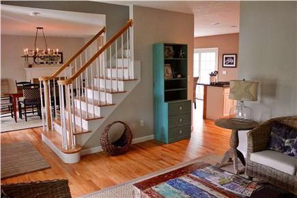 Cape Cod Open Staircase, Open Floor Plan Cape Cod Layout, Cape Home Interior Design, Open Concept With Stairs In Middle Floor Plans, Stairs In Open Floor Plan, Opening A Closed Staircase, Open Staircase Ideas Cape Cod, Open Floor Plan Stairs In Middle, Cape Cod Open Floor Plan Remodel