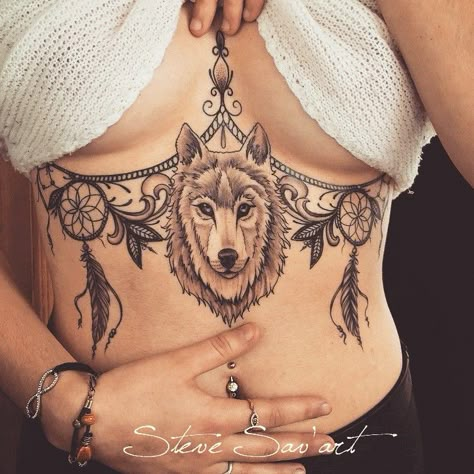 Wolf Dreamcatcher Sternum Tattoo | Tattoo Ideas and Inspiration Tattoo Ideas Wolf, Tattoos Torso, Wolf Dreamcatcher Tattoo, Wolf Tattoos For Women, Underboob Tattoo Designs, Dream Catcher Tattoo Design, Belly Tattoos, Torso Tattoos, Underboob Tattoo