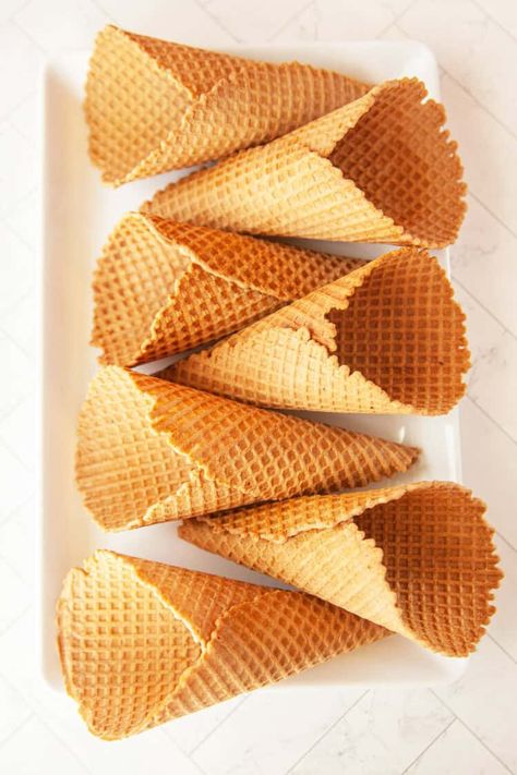 Homemade Waffle Cones are so delicious, easy to make, and perfect for serving up scoops of your favorite ice cream! No reason to go to an ice cream shop - you'll be making waffle cones at home before you know it! Ice Cream Cone Recipe, Homemade Waffle Cones, Homemade Ice Cream Cone, Ice Cream Cones Recipe, Diy Waffles, Homemade Peanut Brittle, Homemade Waffle, Waffle Cone Recipe, Waffle Cone Maker