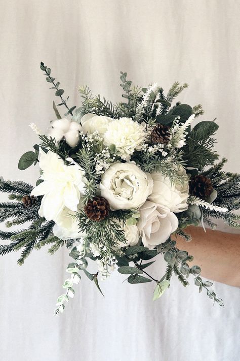 This seasonal bouquet is perfect for your special day. Trust me, this one elevates your bridal look. Collect this inspiration to your winter wedding inspiration. Winter Peonies Bouquet, White And Green Winter Bouquet, Wedding Winter Bouquets, Winter Wedding Bride Bouquet, Small Winter Wedding Bouquet, December Bridal Bouquet, Winter White Bouquet, Flowers For Winter Wedding, Winter Wedding Bouquet Evergreen