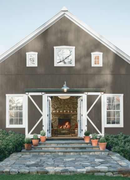 Exterior Walls: Deep Creek 1477, Trim: Decorator's White OC-149 #exteriorpaint #exteriorcolor #benjaminmoore Rustic Farmhouse Exterior, Metal Buildings With Living Quarters, Barn Remodel, Metal Barn Homes, Pole Buildings, Small Barn, Pole Barns, Pole Barn House Plans, Metal Barn