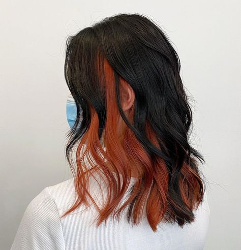 Red Undercolor Hair, Black Hair With Ginger Underneath, Two Hair Colors Underneath, Tri Hair Color Ideas, Dark Orange And Black Hair, Black To Ginger Balayage, Peekaboo Copper Hair, Black Hair With Orange Underneath, Brown Roots Colored Hair