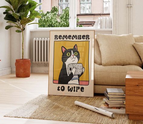 Brighten up your restroom with this adorable and witty poster, which showcases a tuxedo cat holding a roll of toilet paper and the friendly reminder "Remember To Wipe." This delightful print is perfect for adding a splash of charm and humor to any bathroom setting, ensuring both hygiene and giggles. ✅ ABOUT ✔️ Paper options - fine art and matte. 👉 Premium Fine Art Paper (240gsm). ✔️ NB! For indoor use only ⚠️ FRAME IS NOT INCLUDED ✅ SIZES Sizes in inches = 24 x 36, 20 x 30, 18 x 24, 16 x 20, 12 Over Toilet Art, Bathroom Frames Decor Wall Art, Posters For Bathroom, Bathroom Prints Art, Toilet Artwork, Toilet Decor Ideas, Powder Room Art, Cat On Toilet, Prints For Bathroom