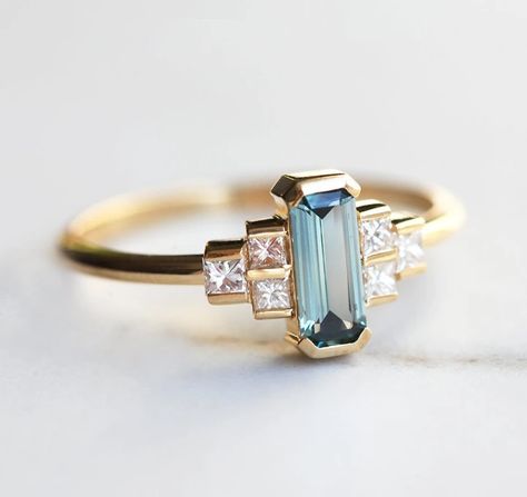 Our Art Deco rings sport stylish, streamlined designs with bold angles and a spirit of triumph. Explore vintage Art Deco engagement rings & more at Capucinne! Art Deco Sapphire Engagement Ring, Teal Sapphire Engagement Ring, Diamond Alternative Engagement Ring, Art Deco Sapphire Ring, Teal Sapphire, Sapphire Engagement Ring, Diamond Engagement Ring Set, Deco Engagement Ring, Sapphire Diamond Ring