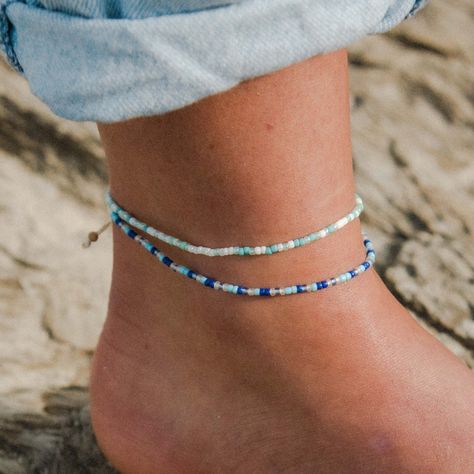 Step onto the sand in style with our Alila beaded anklet. With a wax polyester cord to complement the colour pattern of the beads, this simple beaded anklet design is the subtle accessory your bare ankles will love this summer. The perfect beach anklet, this dainty ankle bracelet will look great stacked with your other Pineapple Island anklets! The perfect Mother's Day Gift. Made with colourful seed beads and a wax polyester cord. Measures approx. 20cm with a 10cm sliding knot extension. Handmad Beachy Anklets, Anklet Design, Summer Accessories Beach, Anklets Diy, Cute Anklets, Ankle Bracelets Diy, Anklet Designs, Beaded Ankle, Summer Anklets