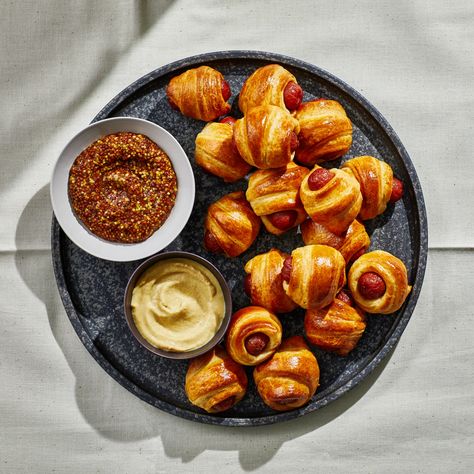 Easy Pigs in a Blanket Recipe | Bon Appétit Pigs In A Blanket Recipe, Best Thanksgiving Appetizers, Pork Dinners, Smoked Cocktails, Sweet Potato Hummus, New Year's Eve Appetizers, Cocktail Sausages, Crescent Dough, Spicy Honey