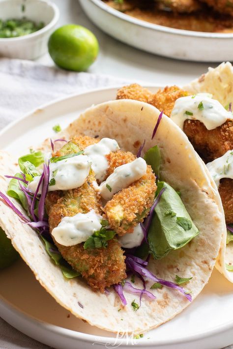 Oven-fried avocado tacos makes a creamy, crispy, meatless weeknight dinner. Serve them with a homemade cilantro yogurt sauce for a zesty kick. Fried Avocado Tacos, Fried Avocado, Avocado Tacos, Avocado Taco, Avocado Fries, Baked Avocado, Oven Fried, Dinners To Make, Cooking For Beginners