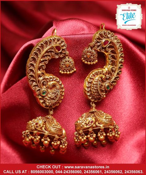 Wow! It's amazing the ever loving loving jhumka with peacock ear cuff is simply heartthrobing and the head turner... this intrigues the attention and admires the beauty. Don't miss it! #goldpeacockjhumkawithmatal Check out : www.saravanastores.in Call us at : 8056003000, 044-24356060, 044-24356061, 044-24356062, 044-24356063 #goldjhumkadesign #goldjhumkamodels #goldjhumkacollection #goldjhumkaset #Saravanaelitegold #Saravanaelite #goldpnecklace #goldnecklace #SaravanaStoresEliteGold Gold Jewellery India, Vintage Indian Jewelry, Antique Gold Earrings, Gold Jhumka Earrings, Gold Bridal Necklace, Antique Necklaces Design, Antique Gold Jewelry Indian, Bridal Jewelry Vintage, Gold Jewelry Simple Necklace